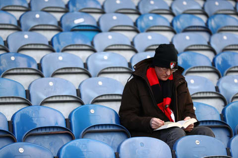 HUDDERSFIELD, ENGLAND – MARCH 09: A fan reads a book inprior to the Premier League match between Huddersfield Town and AFC Bournemouth at John Smith’s Stadium on March 09, 2019 in Huddersfield, United Kingdom. (Photo by Matthew Lewis/Getty Images)