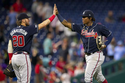 PHILADELPHIA, PA – SEPTEMBER 09: Josh Donaldson #20 of the Atlanta Braves high fives Ronald  Acuna Jr. #13 after the game against the Philadelphia Phillies at Citizens Bank Park on September 9, 2019 in Philadelphia, Pennsylvania. The Braves defeated the Phillies 7-2. (Photo by Mitchell Leff/Getty Images)