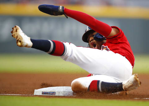 ATLANTA, GA – SEP 20: Ronald Acuna Jr. #13 of the Atlanta Braves slides into third base in the first inning of an MLB game against the San Francisco Giants at SunTrust Park on September 20, 2019 in Atlanta, Georgia. (Photo by Todd Kirkland/Getty Images)