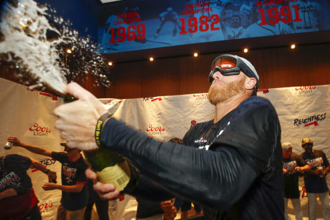 ATLANTA, GA – SEP 20: Mike Foltynewicz #26 of the Atlanta Braves celebrates in the clubhouse with champagne at the conclusion of an MLB game against the San Francisco Giants in which they clinched the NL East. (Photo by Todd Kirkland/Getty Images)