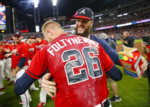 ATLANTA, GA – SEP 20: Dallas Keuchel #60 of the Atlanta Braves dunks Mike Foltynewicz #26 of the Atlanta Braves with milk at the conclusion of an MLB game against the San Francisco Giants in which they clinched the N.L. East at SunTrust Park on September 20, 2019 in Atlanta, Georgia. (Photo by Todd Kirkland/Getty Images)