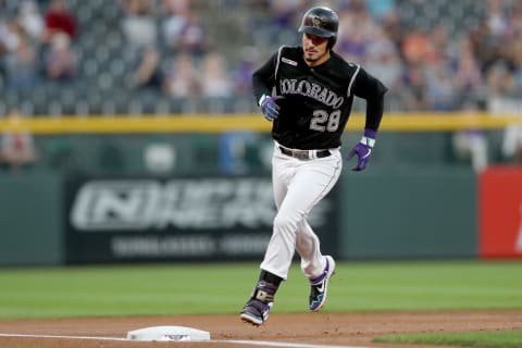 DENVER, COLORADO. Nolan Arenado #28 of the Colorado Rockies circles the bases after hitting a 2 RBI home run in the first inning against the San Diego Padres at Coors Field on September 13, 2019. (Photo by Matthew Stockman/Getty Images)