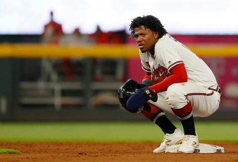 ATLANTA, GEORGIA – SEPTEMBER 17: Ronald  Acuna Jr. #13 of the Atlanta Braves reacts after stealing second base against Jean Segura #2 of the Philadelphia Phillies in the ninth inning SunTrust Park on September 17, 2019 in Atlanta, Georgia. (Photo by Kevin C. Cox/Getty Images)