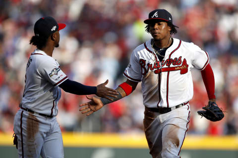 ATLANTA, GEORGIA – OCTOBER 03: Ozzie Albies #1 and Ronald Acuna Jr. #13 of the Atlanta Braves. (Photo by Todd Kirkland/Getty Images)