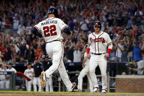 Nick Markakis #22 of the Atlanta Braves scores a run against the St. Louis Cardinals during game one of the 2019 NLDS (Photo by Kevin C. Cox/Getty Images)