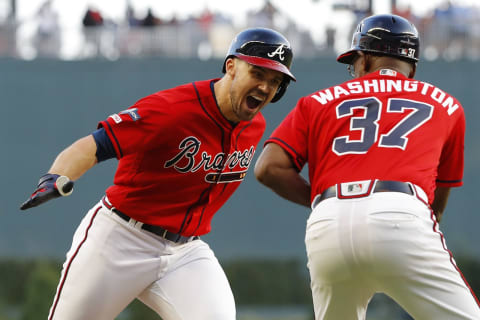 ATLANTA, GEORGIA – OCTOBER 04: Adam Duvall #23 of the Atlanta Braves celebrates with third base coach Ron Washington #37 after a two-run home run off Jack Flaherty #22 of the St. Louis Cardinals in the seventh inning in game two of the National League Division Series at SunTrust Park on October 04, 2019 in Atlanta, Georgia. (Photo by Kevin C. Cox/Getty Images)