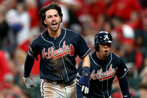 ST LOUIS, MISSOURI – OCTOBER 06: Dansby Swanson #7 and Rafael Ortega #18 of the Atlanta Braves celebrate after scoring the go-ahead runs against the St. Louis Cardinals during the ninth inning in game three of the National League Division Series at Busch Stadium on October 06, 2019 in St Louis, Missouri. (Photo by Jamie Squire/Getty Images)