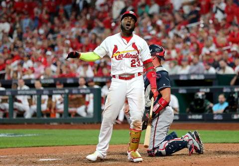 ST LOUIS, MISSOURI – OCTOBER 06: Marcell Ozuna #23 of the St. Louis Cardinals reacts after being called out on strikes against the Atlanta Braves during the ninth inning in game three of the National League Division Series at Busch Stadium on October 06, 2019 in St Louis, Missouri. (Photo by Jamie Squire/Getty Images)