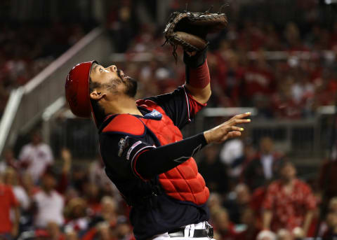 WASHINGTON, DC – OCTOBER 14: Catcher Kurt  Suzuki #28 of the Washington Nationals makes a catch on Yadier Molina #4 of the St. Louis Cardinals during the second inning of game three of the National League Championship Series at Nationals Park on October 14, 2019 in Washington, DC. (Photo by Patrick Smith/Getty Images)