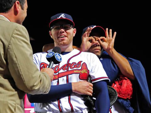 ATLANTA, GA – MAY 30: Freddie Freeman #5 of the Atlanta Braves is interviewed as Livan Hernandez #61 gestures after a game against the St. Louis Cardinals. (Photo by Scott Cunningham/Getty Images)