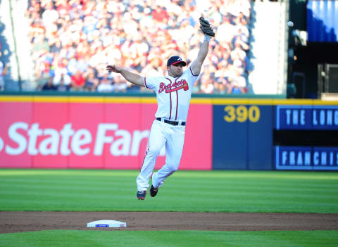 ATLANTA, GA – OCTOBER 5: Dan Uggla #26 of the Atlanta Braves is unable to reach an errant throw by Chipper Jones #10 against the St. Louis Cardinals during the National League Wild Card Game at Turner Field on October 5, 2012 in Atlanta, Georgia. (Photo by Scott Cunningham/Getty Images)