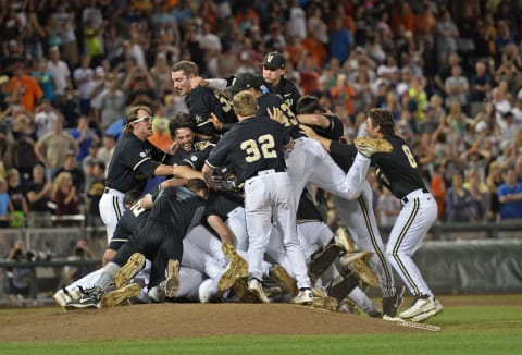 Omaha, NE – JUNE 25: Vanderbilt Commodores players celebrate after beating the Virginia Cavaliers 3-2 to win the College World Series Championship Series on June 25, 2014 at TD Ameritrade Park in Omaha, Nebraska. (Photo by Peter Aiken/Getty Images)