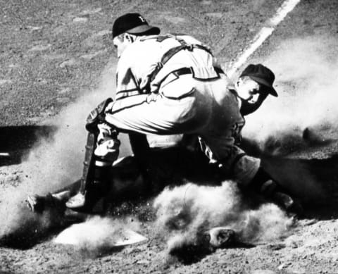 1952: Brooklyn Dodger catcher Roy Campanella slides into Boston Braves catcher Del Crandall. (Photo Reproduction by Transcendental Graphics/Getty Images)