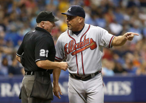 ST. PETERSBURG, FL – AUGUST 11: Manager Fredi Gonzalez #33 of the Atlanta Braves argues with umpire Lance Barksdale #23 after Eury Perez #14 of the Braves was called out on batter’s interference. (Photo by Brian Blanco/Getty Images)