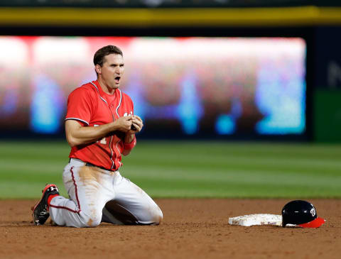 ATLANTA, GA – APRIL 12: Third baseman Ryan Zimmerman #11 of the Washington Nationals looks at his hand after being picked off of second base during the game against the Atlanta Braves at Turner Field on April 12, 2014 in Atlanta, Georgia. Zimmerman would left the game for further evaluation. (Photo by Mike Zarrilli/Getty Images)