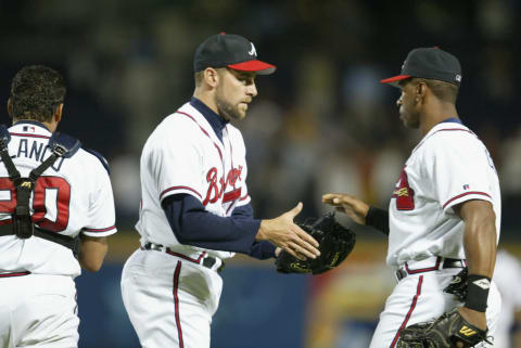 ATLANTA – APRIL 24: Closing pitcher John Smoltz #29 of the Atlanta Braves receives a congratulatory handshake from teammate first baseman Julio Franco #4 after picking up his seventh save of the season against the Arizona Diamondbacks after the MLB game at Turner Field in Atlanta, Georgia on April 24, 2002. The Braves won 4-3. (Photo by Jamie Squire/Getty Images)