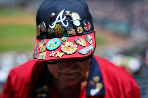 ATLANTA, GA – JULY 17: Pins cover the hat of Atlanta Braves usher David Caudell during the game against the Colorado Rockies at Turner Field on July 17, 2016 in Atlanta, Georgia. Atlanta won 1-0. (Photo by Kevin Liles/Getty Images)