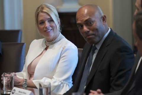 WASHINGTON, DC – MARCH 29: Florida Attorney General Pam Bondi (L) and former New York Yankees great Mariano Rivera (R) listen to U.S. President Donald Trump at a panel discussion on an opioid and drug abuse in the Roosevelt Room of the White House March 29, 2017. (Photo by Shawn Thew-Pool/Getty Images)