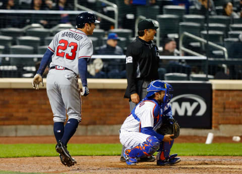 Chase d’Arnaud of the Atlanta Braves scores past disinterested brother Travis d’Arnaud of the New York Mets on April 5, 2017. (Photo by Jim McIsaac/Getty Images)