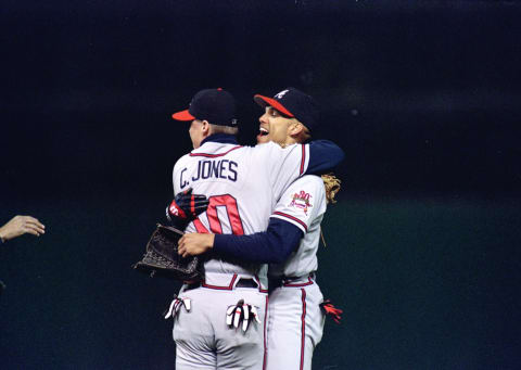 David Justice of the Atlanta Braves is congratulated by Chipper Jones #10. Mandatory Credit: Otto Greule Jr. /Allsport