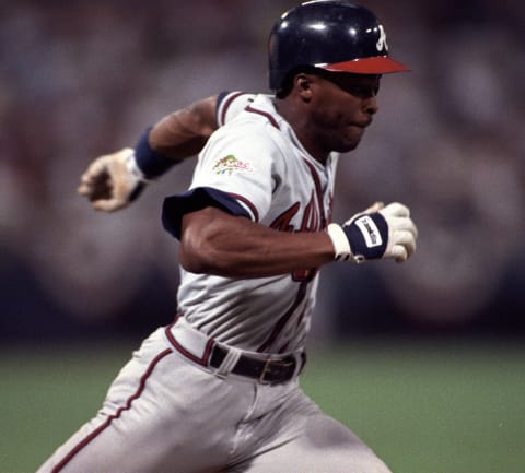 Ron Gant of the Atlanta Braves runs to first base during Game 6 of the 1991 World Series. (Photo by Ronald C. Modra/Getty Images)