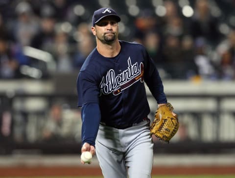 NEW YORK – Buddy Carlyle #38 of the Atlanta Braves flips the ball to first base for an out against the New York Mets on May 11, 2009. (Photo by Jim McIsaac/Getty Images)