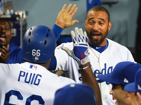 LOS ANGELES, CA – MAY 22: Yasiel Puig #66 of the Los Angeles Dodgers is greeted in the dugout by Matt Kemp #27 of the Los Angeles Dodgers after a solo home run in the sixth inning of the game against the Colorado Rockies at Dodger Stadium on May 22, 2018 in Los Angeles, California. (Photo by Jayne Kamin-Oncea/Getty Images)