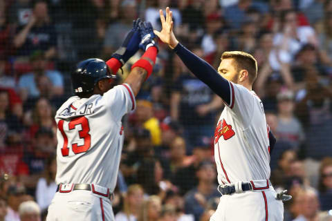 BOSTON, MA – MAY 25: Freddie Freeeman #5 high fives Ronald Accuna Jr. #13 of the Atlanta Braves after both scoring in the third inning of a game against the Boston Red Sox at Fenway Park on May 25, 2018 in Boston, Massachusetts. (Photo by Adam Glanzman/Getty Images)