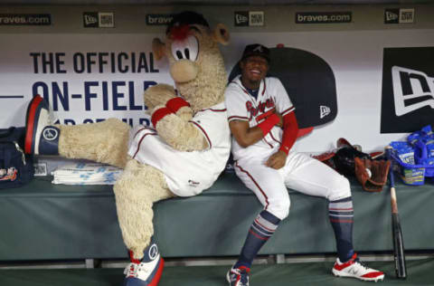 ATLANTA, GA – JULY 31: Atlanta Braves mascot Blooper and left fielder Ronald Acuna, Jr. #13 play around in the dugout during a rain delay before the game against the Miami Marlins at SunTrust Park on July 31, 2018 in Atlanta, Georgia. (Photo by Mike Zarrilli/Getty Images)