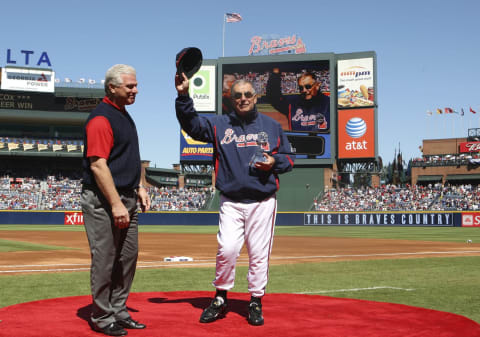 Atlanta Braves Manager Bobby Cox seen here getting a trophy commemorating his 2,500th and general manager Frank Wren (on the left) didn’t see eye-to-eye on acquiring Julio Franco back in 2002. (Photo by Mike Zarrilli/Getty Images)