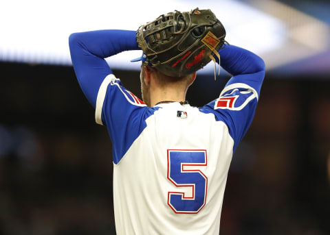 Freddie Freeman #5 of the Atlanta Braves reacts after a replay was called in favor of Alec Bohm of the Philadelphia Phillies. (Photo by Todd Kirkland/Getty Images)