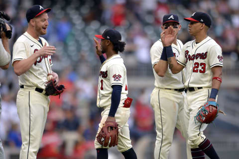 Will Smith #51, Ozzie Albies #1, Austin Riley #27, and Ehire Adrianza #23 of the Atlanta Braves. (Photo by Edward M. Pio Roda/Getty Images)