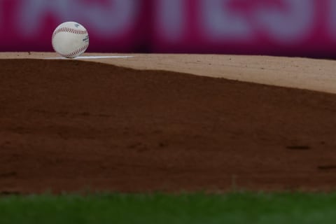 A Rawlings baseball sits on the pitchers mound. (Photo by Rich Schultz/Getty Images)