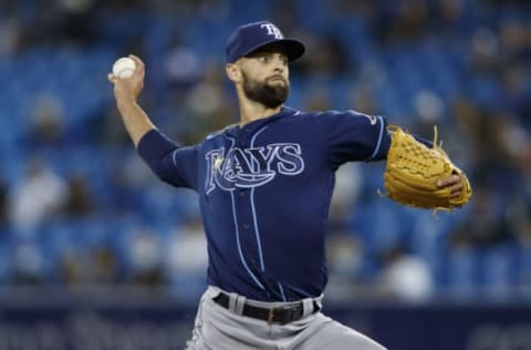 TORONTO, ONTARIO – SEPTEMBER 13: Nick Anderson #70 of the Tampa Bay Rays pitches in the seventh inning of their MLB game against the Tampa Bay Rays at Rogers Centre on September 13, 2021 in Toronto, Ontario. (Photo by Cole Burston/Getty Images)