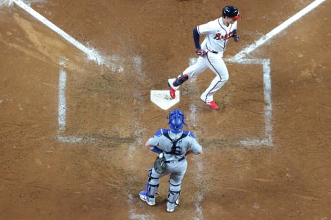 Austin Riley of the Atlanta Braves crosses home plate after hitting a solo home run off Tony Gonsolin of the Dodgers during the fourth inning of Game 1 of the NLCS. (Photo by Kevin C. Cox/Getty Images)