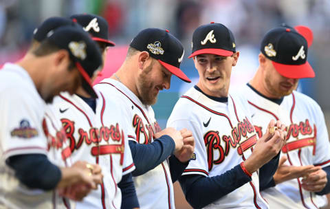 Max Fried of the Atlanta Braves looks at his World Series Ring with teammates during the Ring Ceremony at Truist Park on April 9, 2022. (Photo by Adam Hagy/Getty Images)