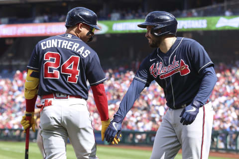 PHILADELPHIA, PENNSYLVANIA – SEPTEMBER 25: William Contreras #24 (L) and Travis d’Arnaud #16 of the Atlanta Braves celebrate during the first inning against the Philadelphia Phillies at Citizens Bank Park on September 25, 2022 in Philadelphia, Pennsylvania. (Photo by Tim Nwachukwu/Getty Images)