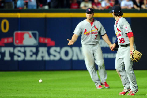 Matt Holliday and Pete Kozma of the St. Louis Cardinals react after the ball hits the grass as the infield fly rule is called against the Atlanta Braves. (Photo by Scott Cunningham/Getty Images)