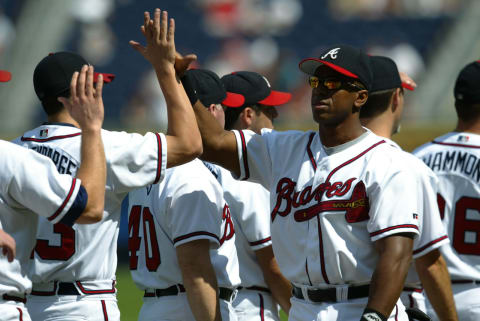 ATLANTA – October 2: First baseman Julio Franco #23 of the Atlanta Braves high-fives his teammates during player introductions prior to Game one of the National League Divisional Series against the Atlanta Braves at Turner Field on October 2, 2002, in Atlanta, Georgia. The Giants won 8-5. (Photo by Jamie Squire/Getty Images)