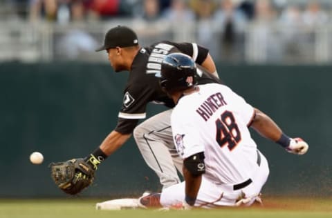 MINNEAPOLIS, MN – APRIL 30: Torii Hunter #48 of the Minnesota Twins slides into second base with a double as Micah Johnson #7 of the Chicago White Sox fields the ball during the first inning of the game on April 30, 2015 at Target Field in Minneapolis, Minnesota. (Photo by Hannah Foslien/Getty Images)