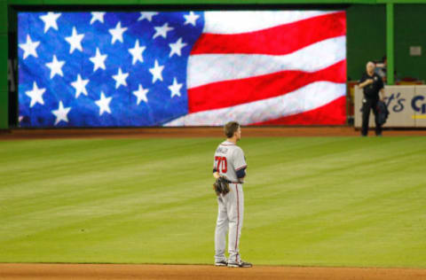 MIAMI, FL – SEPTEMBER 27: Pitcher Daniel Winkler #70 of the Atlanta Braves stands during singing of ‘God Bless America’ in the seventh inning of play against the Miami Marlins at Marlins Park on September 27, 2015 in Miami, Florida. (Photo by Joe Skipper/Getty Images)