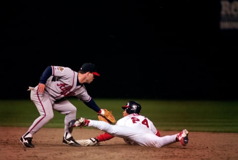 24 Oct 1995: Mike Mordecai of the Atlanta Braves tags out Manny Ramirez #24 of the Cleveland Indians during the World Series.