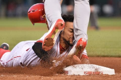 CINCINNATI, OH – JUNE 8: Billy Hamilton #6 of the Cincinnati Reds slides into the legs of Jhonny Peralta #27 of the St. Louis Cardinals while trying to steal third base in the fifth inning at Great American Ball Park on June 8, 2016 in Cincinnati, Ohio. Hamilton was called out as St. Louis defeated Cincinnati 12-7. (Photo by Jamie Sabau/Getty Images)