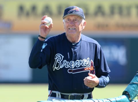 Former Atlanta Braves pitcher and Baseball Hall-of-Fame member Phil Niekro looks on while pitching batting practice. (Photo by Mark Cunningham/MLB Photos via Getty Images)