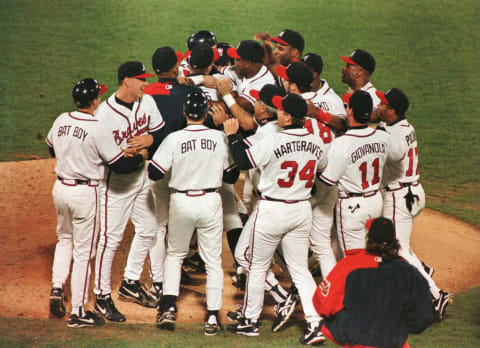 The Atlanta Braves celebrate after defeating the St Louis Cardinals 15-0 in game 7 of the 1996 NLCS. Mandatory Credit: Matthew Stockman/Allsport