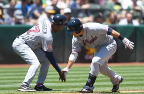 OAKLAND, CA – JULY 02: Kurt Suzuki #24 of the Atlanta Braves is congratulated by third base coach Ron Washington #37 after Suzuki hit a solo home run against the Oakland Athletics in the top of the second inning at Oakland Alameda Coliseum on July 2, 2017 in Oakland, California. (Photo by Thearon W. Henderson/Getty Images)