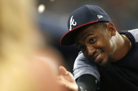 ATLANTA, GA – SEPTEMBER 15: Pitcher Julio Teheran #49 of the Atlanta Braves throws sunflower seeds at Fox Sports South field reporter Kelsey Wingert while she shoots a live report in the third inning during the game between the New York Mets and the Atlanta Braves at SunTrust Park on September 15, 2017 in Atlanta, Georgia. (Photo by Mike Zarrilli/Getty Images)