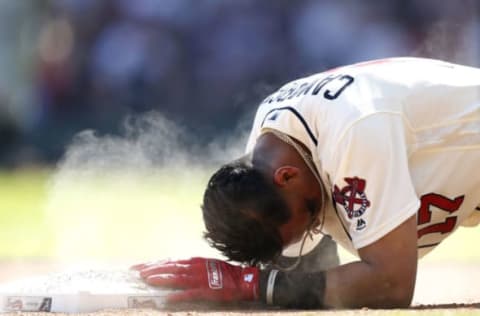 ATLANTA, GA – MAY 06: Shortstop Johan Camargo #17 slides back into third base in the ninth inning during the game against the San Francisco Giants at SunTrust Park on May 6, 2018 in Atlanta, Georgia. (Photo by Mike Zarrilli/Getty Images)