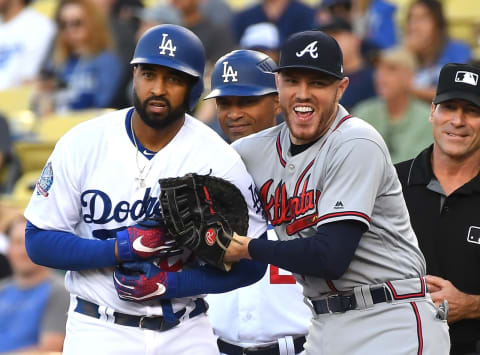 LOS ANGELES, CA – JUNE 08: Matt Kemp #27 of the Los Angeles Dodgers and Freddie Freeman #5 of the Atlanta Braves share a laugh after Kemp singled in the first inning at Dodger Stadium on June 8, 2018 in Los Angeles, California. (Photo by Jayne Kamin-Oncea/Getty Images)