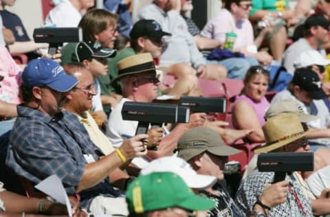 ST. PETERSBURG, FL – MARCH 6: MLB team scouts keep their radar guns trained on the pitchers as the Tampa Bay Devil Rays go on to defeat the Pittsburgh Pirates 5-3 in an MLB Spring Training game at the Progress Energy Park on March 6, 2005 in St. Petersburg, Florida. (Photo by Doug Pensinger/Getty Images)